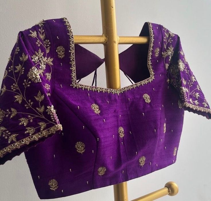 Hand embroidered ready made pure raw silk saree blouse / crop top/stitched saree blouse usa /purple hand saree blouse/ hand embroidered blouse/zardosi blouse/puple heavy bridal saree blouse/ pure silk blouse/ purple wedding heavy maggam work blouse        It is very true that a perfect blouse is the one which makes your saree look stand out !! If you find one of such a style that you have been wanting to have then dont let it go !! we carry such unique trending blouses that instantly add a stylish look to any saree !!     Well..!! we understand that you may not get in your desired size/pattern, here you go with customization according to your size/pattern which we can deliver in 1-2 weeks of time period !!      Here is a beautiful pure raw silk heavy Hand embroidered saree blouse in purple Purple Blouse Designs, Zardosi Blouse, Hand Embroidery Blouse, Lengha Blouse, Ready Made Blouse, Maggam Blouse, Hand Embroidered Blouse, Bridal Blouses, Latest Bridal Blouse Designs