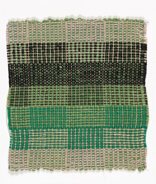 a piece of cloth with green and black stripes