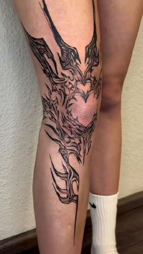 a woman's leg with tattoos on it and a bird in the middle of her leg