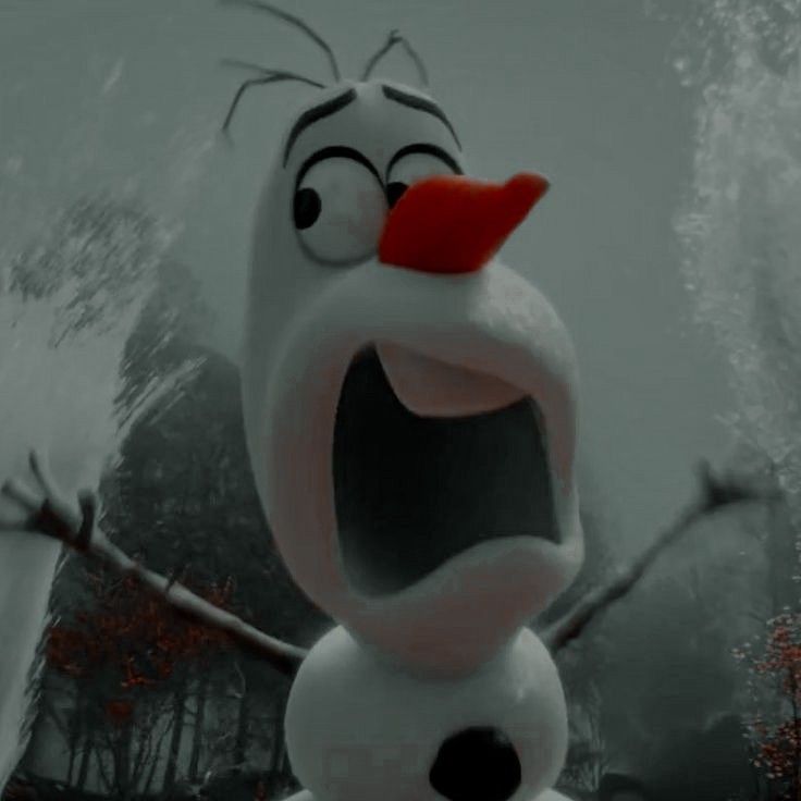 a snowman with his mouth open and tongue out