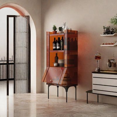 a room with an arched doorway and shelves filled with bottles