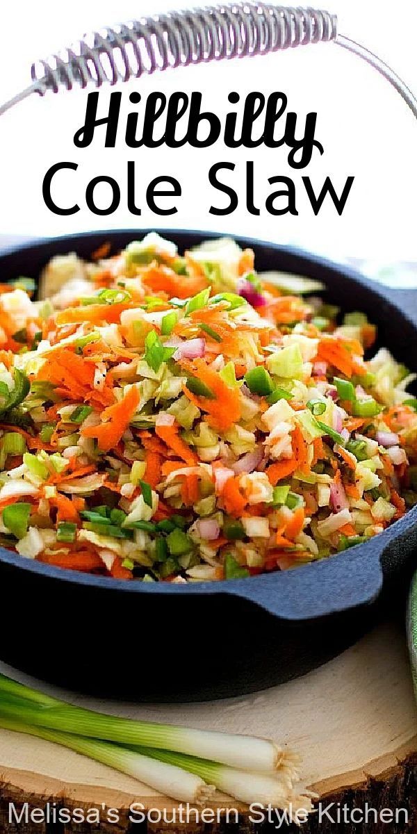 a skillet filled with cole slaw on top of a cutting board next to celery