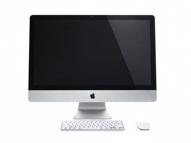 an apple desktop computer sitting on top of a white desk next to a mouse and keyboard