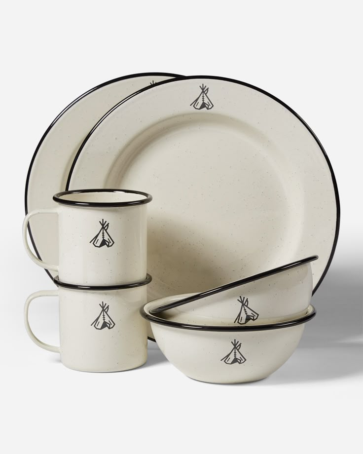 a white dinner set with black trimmings