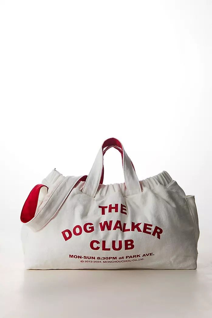 the dog walker club bag is white with red lettering on it and has a red ball inside