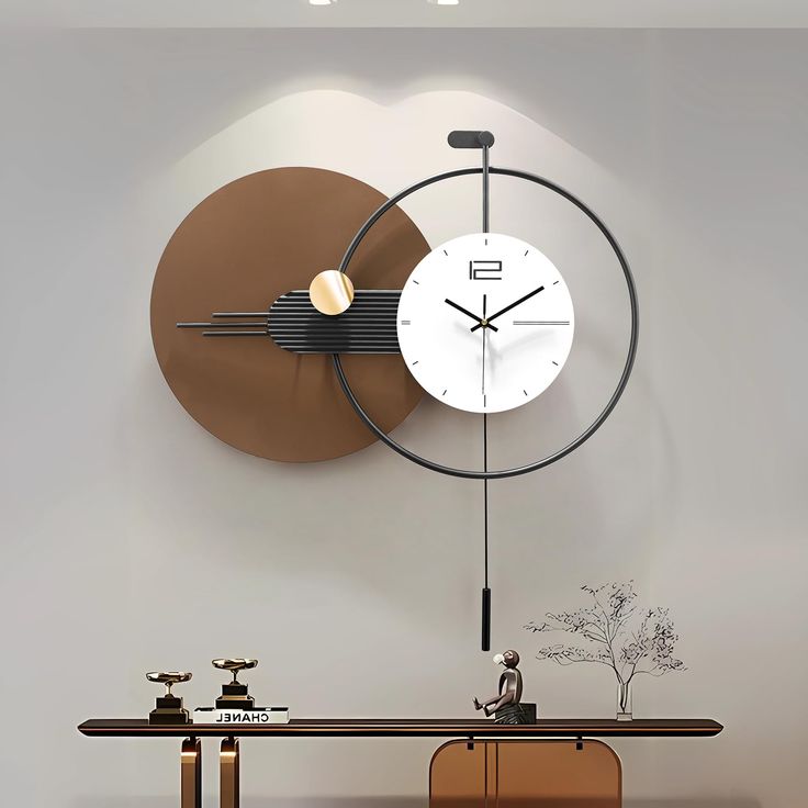 a large clock mounted to the side of a wall next to a wooden table and chair