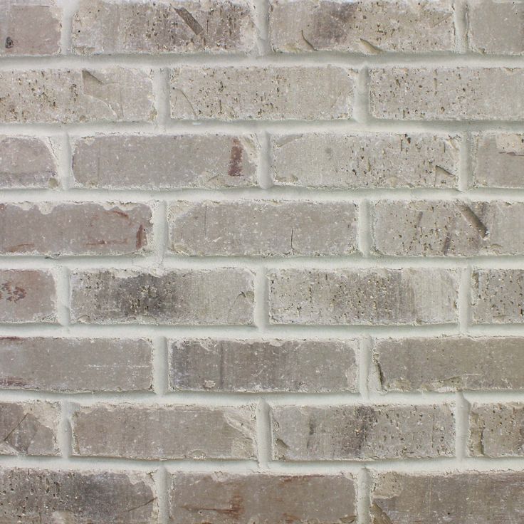 an image of a brick wall that looks like it is made out of cement bricks