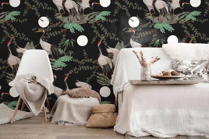 a living room filled with furniture and wallpaper covered in birds