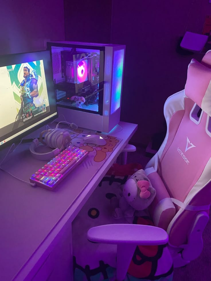 a desk with two computer monitors and a keyboard on it, in front of a purple chair