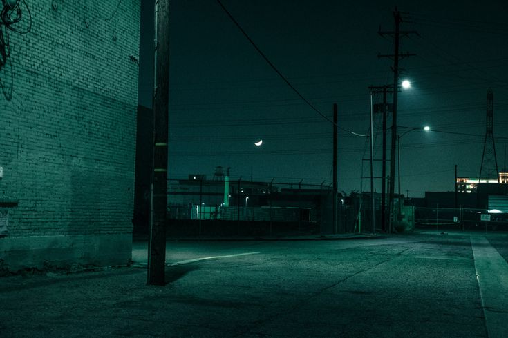 an empty street at night with no one on it