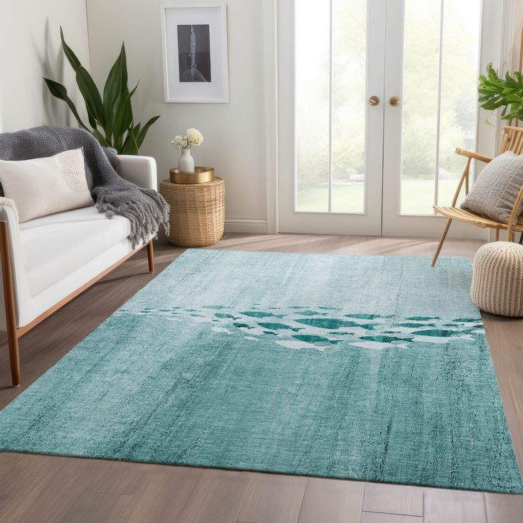 a living room with a blue rug on the floor