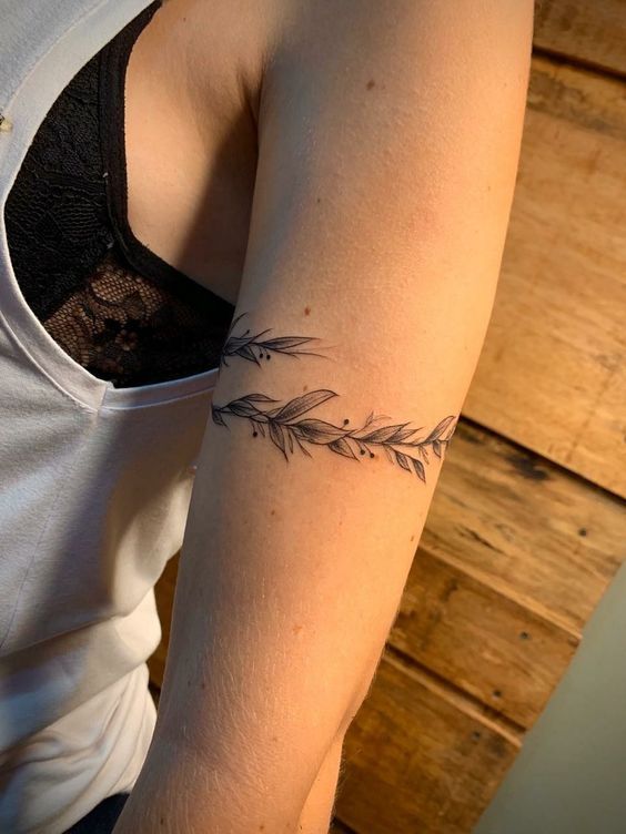 a woman with a tattoo on her arm