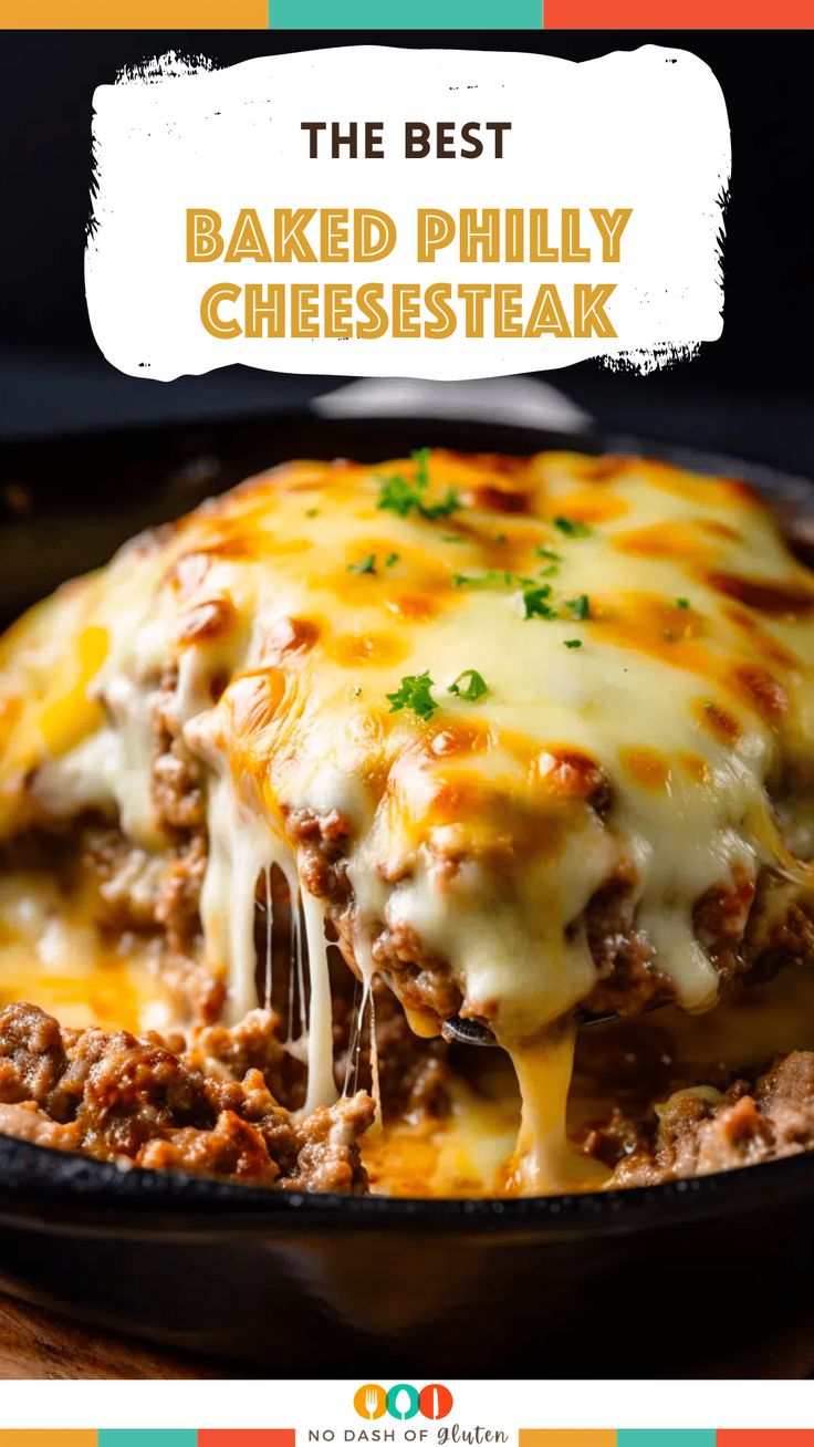 the best baked philly cheese steak in a cast iron skillet with melted cheese on top