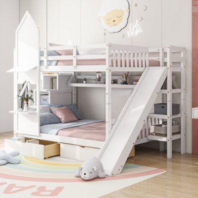 a child's bedroom with bunk beds, slide and rugs on the floor