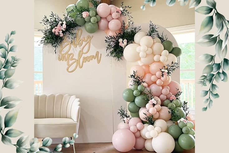 the balloon arch is decorated with greenery and balloons