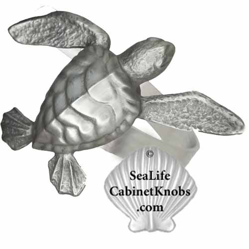 the sea life cabinet knobs com logo is shown with a turtle on it's back