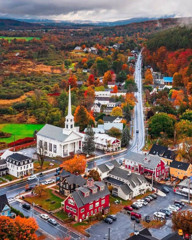 an aerial view of a town in the fall