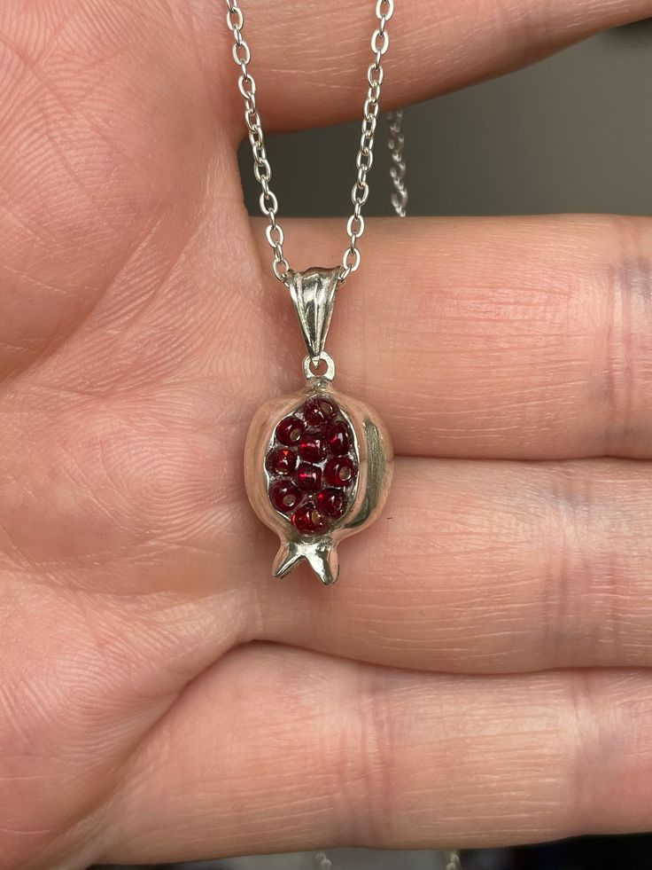 PENDENT Armenian necklace Pomegranate  100% Hand Made of 925 Sterling silver  FROM top quality Armenian MASTER Silver (not marked) + Material: silver + Stone: Zircon + chain: Silver size 42cm (16.5 inches)  Style 1 + Size [approximately]: 1.5cm (0.59 inches) + Weight [approximately]: 3.19 gr. Style 2 + Size [approximately]: 1.8cm (0.70 inches) + Weight [approximately]: 3.11gr. Style 3 + Size [approximately]: 1.5 cm(0.59- inches) + Weight [approximately]: 2.84 gr. For information (If you Want many we can do big discount, you must contact before) !!GOOD LUCK AND HAPPY BIDDING Feedback Positive Feedback is our life. If you have not received item in 30 days please contact us and we will try help. We need that all our buyers were happy. This is important. Shipping It takes approximately 15-25 d Silver Garnet Necklaces For Gifts, Armenian Jewelry, Pomegranate Necklace, Symbol Of Life, Handmade Chain, Dope Jewelry, Funky Jewelry, Jewelry Lookbook, Bijoux Diy