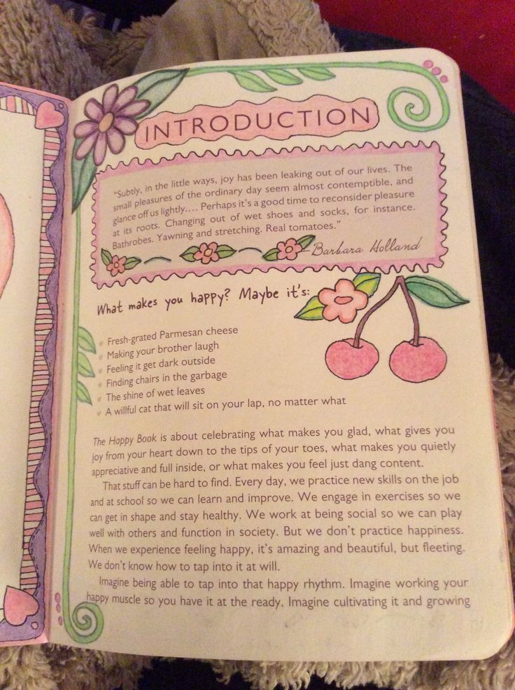 an open children's book with pictures of apples and flowers on it, in front of a teddy bear