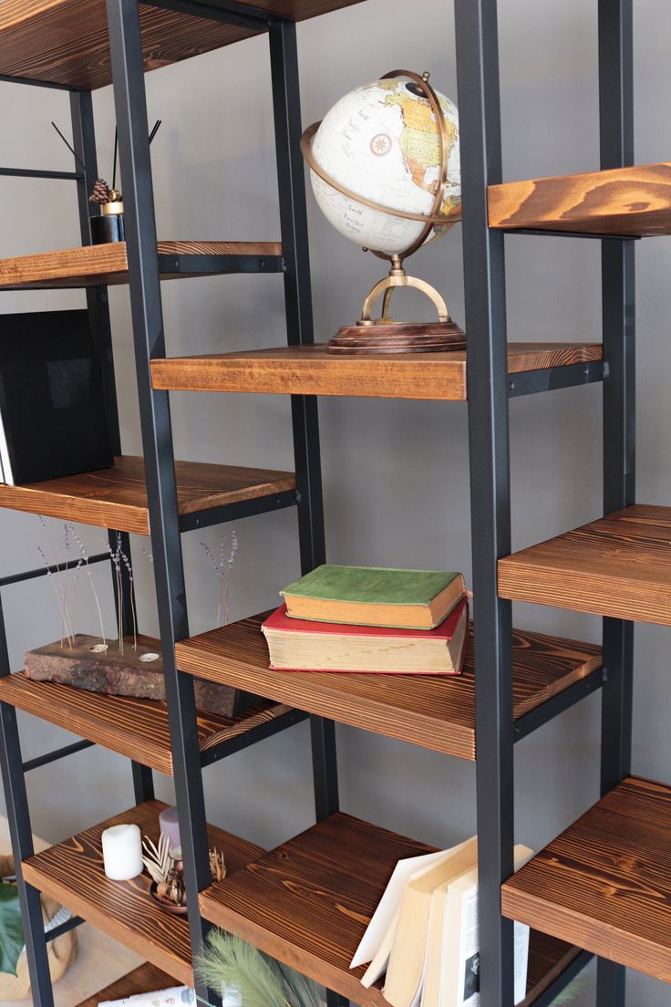 a bookshelf filled with lots of wooden shelves