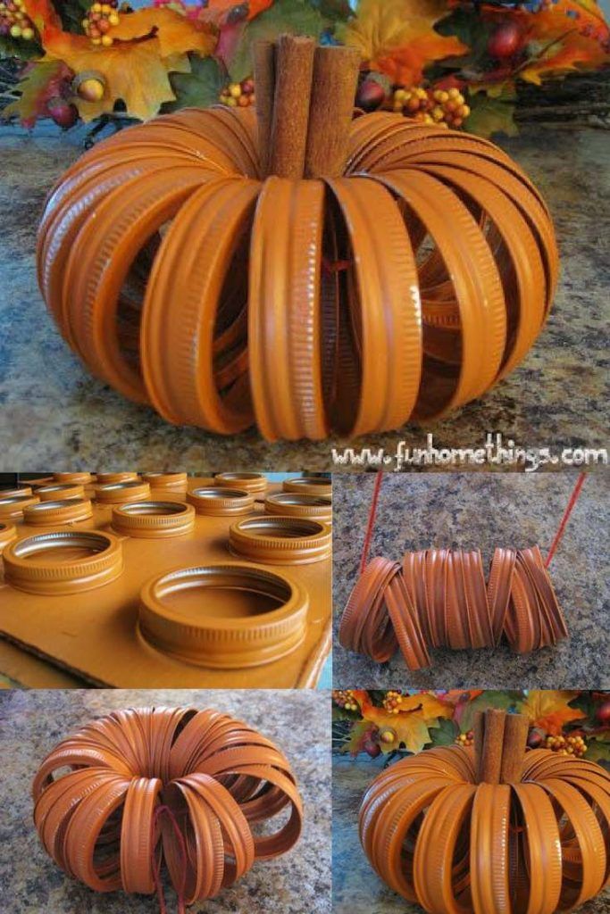 an orange pumpkin made out of plastic tubes and some other things on the ground with fall leaves in the background