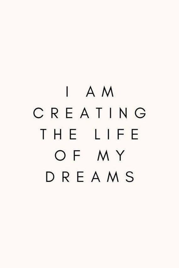 the words i am creating the life of my dreams written in black on a white background