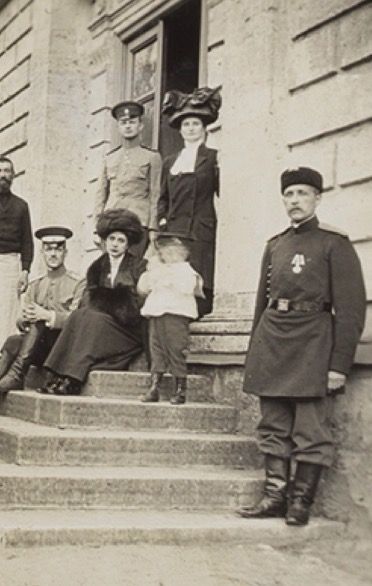 an old black and white photo of people on steps