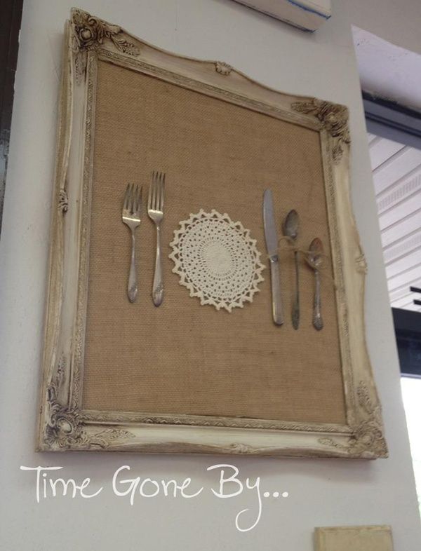 a place setting with silverware and utensils is displayed on the wall