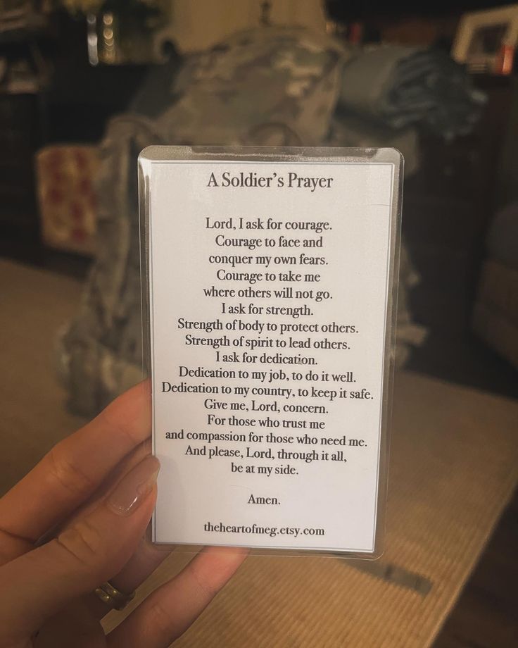 someone is holding up a prayer card for their loved friend, soldier's prayer