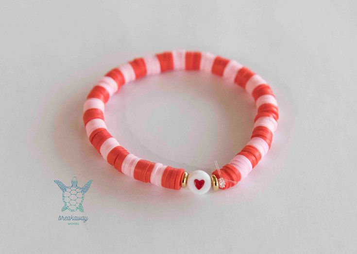 This bracelet is made of red and pink clay disc beads, with faux gold spacers and a red heart. All strung on an elastic cord.  Makes a perfect gift for your Valentine! Bracelet measures 6" Production takes 2-3 business days. Colors might look slightly different as they vary on a different screen. May arrive separately from other items. ++ Policies ++ I do not offer refunds or exchanges unless the item arrives damaged. Photo proof of damage is required to process a return/refund. Please check the production + shipping times of items before purchase. Contact me if you have questions before you buy. I do not accept returns or exchanges for sizing, so size up if unsure with the fit or fabric, or contact me for personal assistance on picking a size. Breakaway Waves is not responsible for lost o Playful Red Stretch Bracelet For Gift, Playful Red Beaded Bracelets, Cute Red Stretch Bracelet For Friendship, Cute Red Friendship Stretch Bracelet, Trendy Red Stretch Bracelet For The Beach, Trendy Red Stretch Bracelet For Beach, Red Adjustable Heishi Beads Stretch Bracelet, Adjustable Red Heishi Beads Stretch Bracelet, Red Clay Bead Bracelet