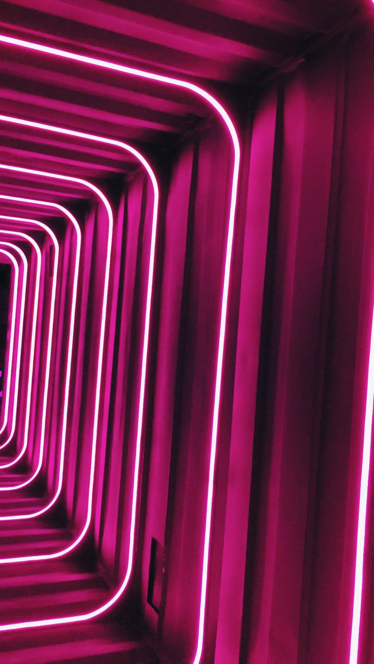 an image of a tunnel with neon lights