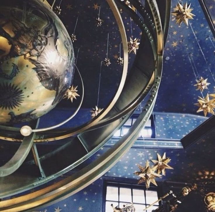 the ceiling is decorated with stars and ornaments