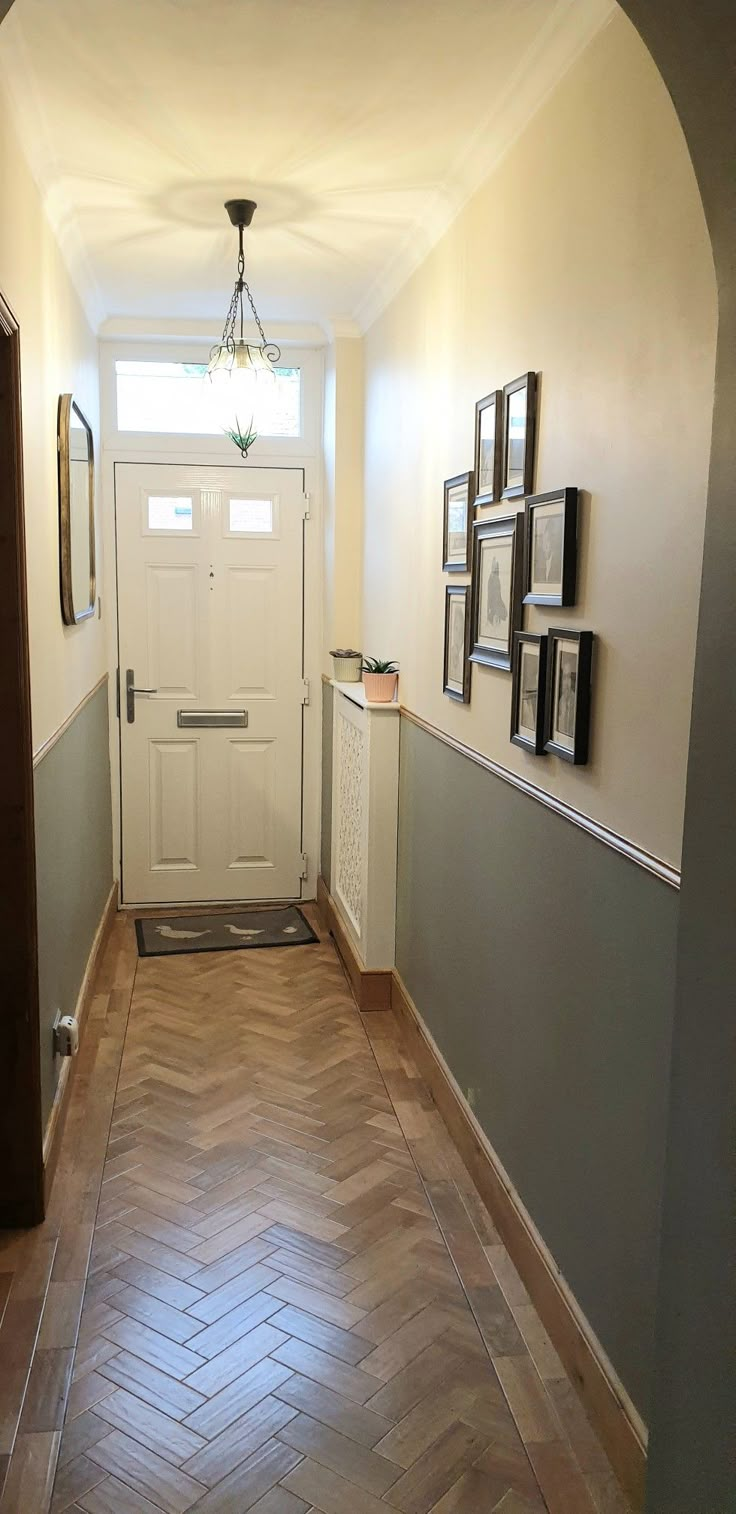 the hallway is clean and ready to be used as a home decorating area for guests