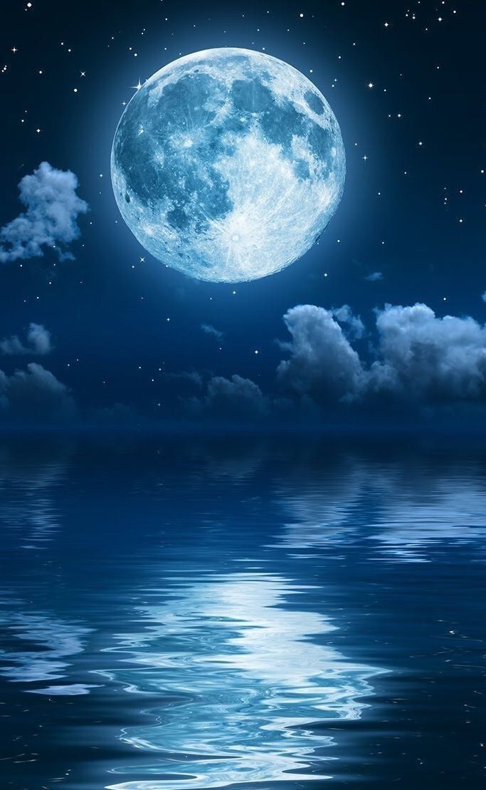 a full moon is reflected in the water at night with clouds and stars above it