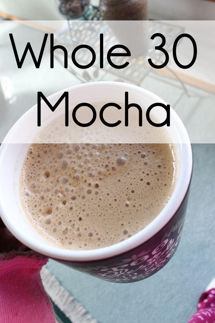 a close up of a cup of coffee with the words whole 30 mocha on it