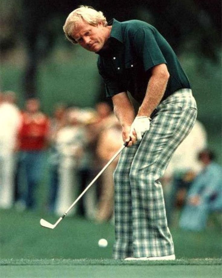 an older man in plaid pants playing golf