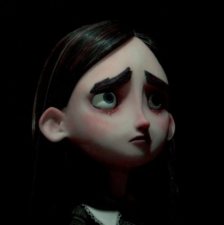 an animated doll with long black hair and blue eyes is staring at the camera,