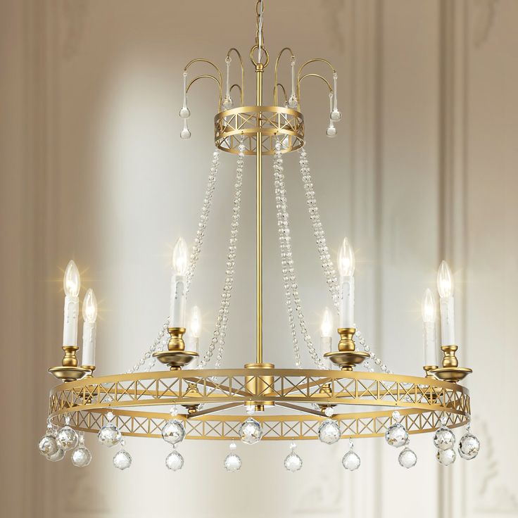 a chandelier hanging from the ceiling in a room with white walls and flooring