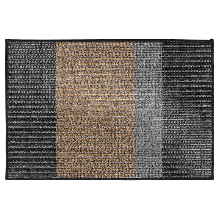 a rug with different colors and patterns on the front, one is black, white, grey