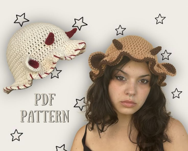 a woman wearing a crocheted hat with horns and stars around her head is looking at the camera