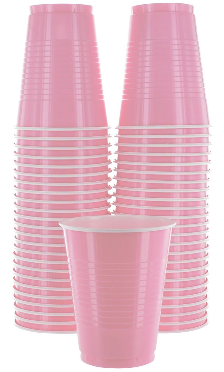 pink plastic cups are stacked on top of each other