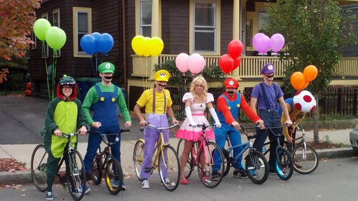 a group of people on bikes with balloons