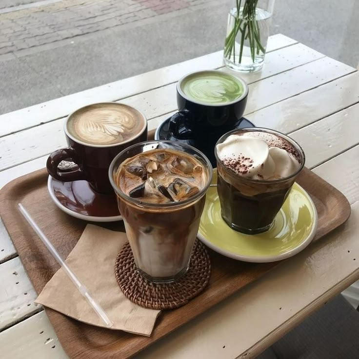 three different types of drinks on a tray