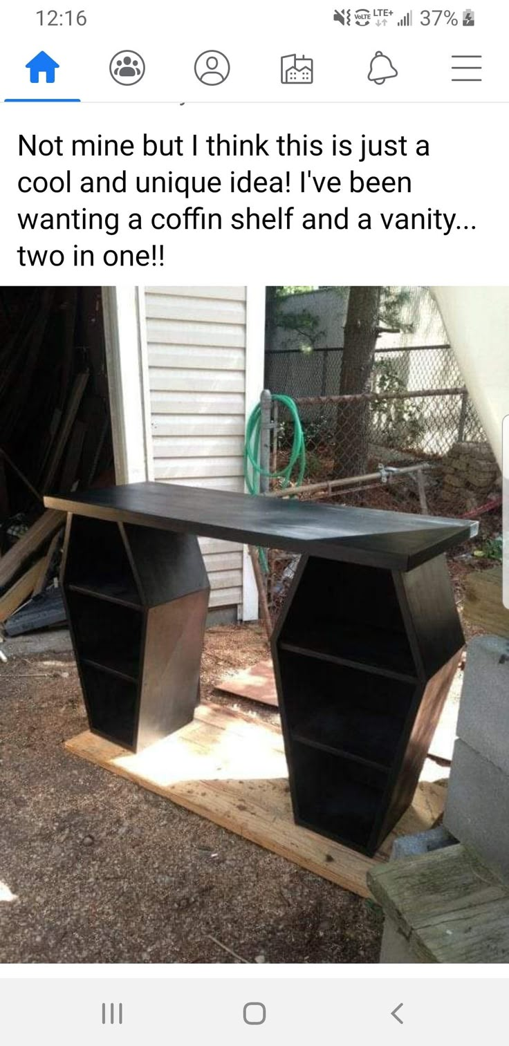 a table that is made out of some kind of metal and has been placed in the yard