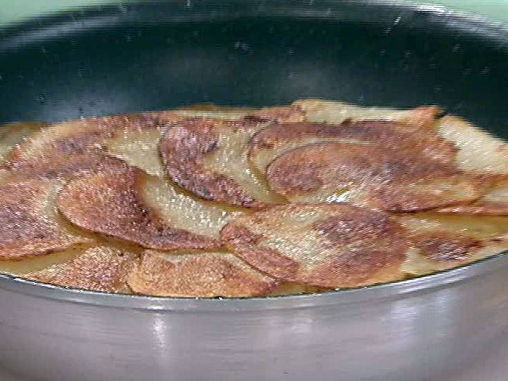 some food is cooking in a pan on top of the stove and it looks like they have been cooked