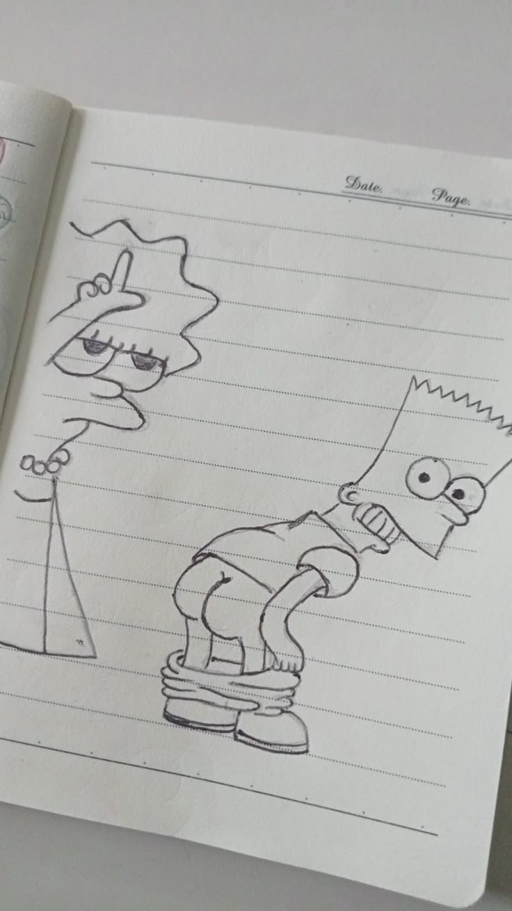 an open notebook with a drawing of a cartoon character and a person on a skateboard