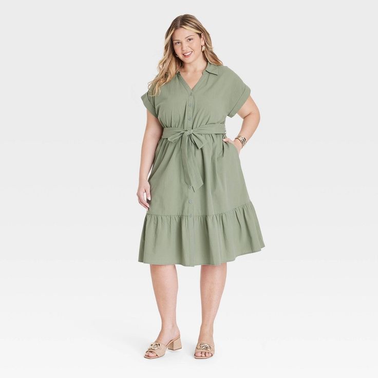 Take on any day in cool style donning this Short-Sleeve Tiered Midi Shirtdress from Ava & Viv™. Made of lightweight gauze cotton, this midi dress is tailored with a collared neckline featuring a full-length button placket down the front, short dolman sleeves with rolled cuffs and functional side pockets. A sash-tie belt for cinching your waist and a tiered hem for a frilly finish complete the look. Pair it with your fave accessories and sandals for an outfit that will be sure to impress. Green Dresses Casual, Olive Green Dress Casual, Light Olive Green, Maxi Bodycon Dress, Green Dress Casual, Olive Green Dresses, Green Dresses, Mini Skater Dress, Flare Mini Dress