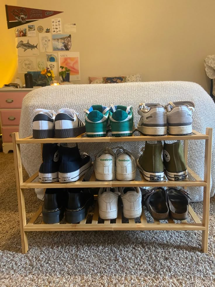 there are many pairs of shoes on the shelf