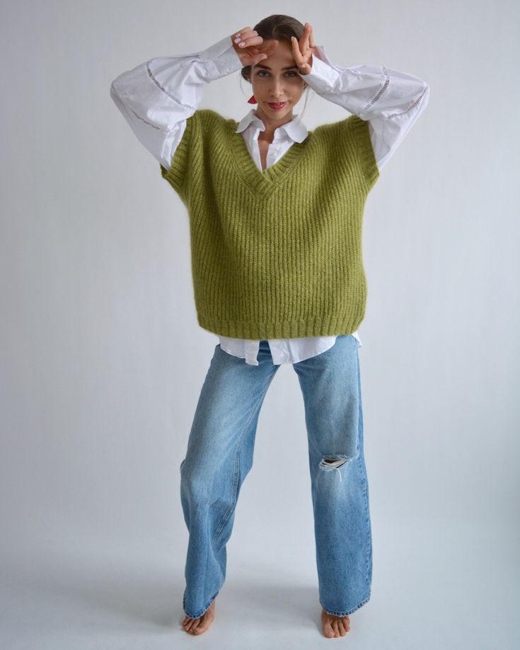 Green Knitted Winter Vest, Sleeveless Green Sweater For Fall, Green Knitted Sleeveless Sweater Vest, Green Sleeveless Knitted Sweater, Green Knit Vest For Fall, Hand Knitted Sleeveless Winter Vest, Hand Knitted Sleeveless Sweater Vest For Winter, Olive Green Vest Outfit, Green Vest Outfit