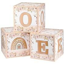 three wooden blocks with the letters e, f, and o in gold on them